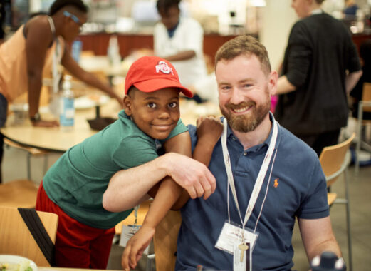 Happy white adoptive father with black transracial adoptee son